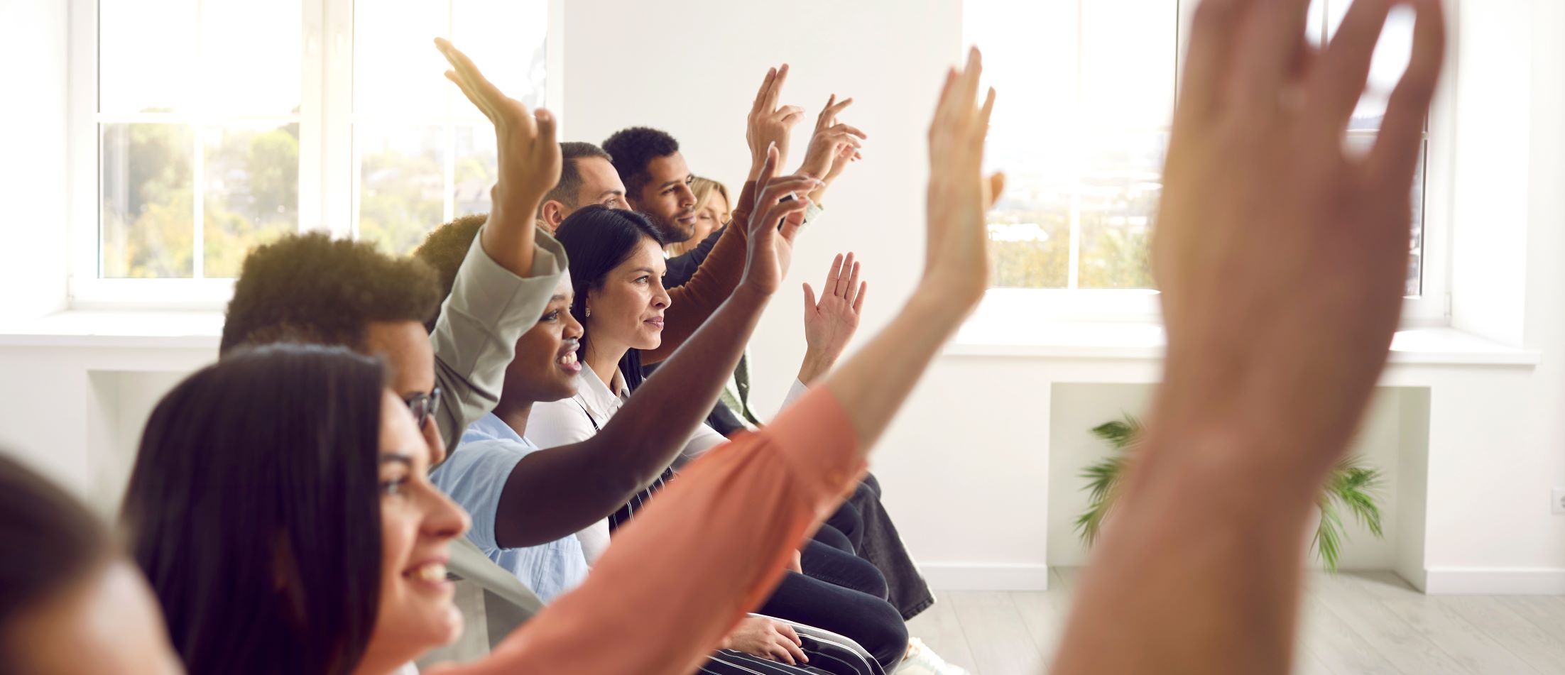 Row of hands up during training session