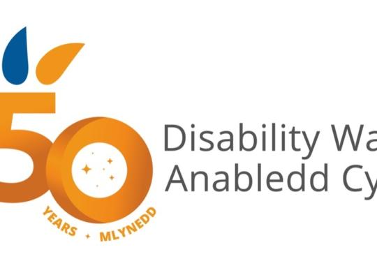 The gold and blue Disability Wales logo. It is a gold and blue number 50 and the text reads Disability Wales, Anabledd Cymru.