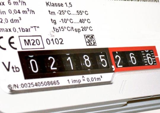 image shows close up of a gas meter. black numbers on a white meter indicating amount of energy used.