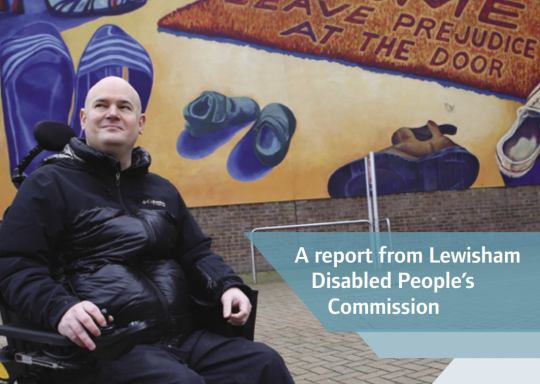 An image of the front cover of the Lewisham Disabled People's Commission, with a photo of a man wearing a black coat and trousers sitting in a wheelchair, looking up smiling. Behind him there is street art on Lewisham Shopping Centre, that has different p