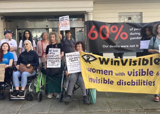 DPOs protesting outside the inquiry with Winvisble Banners