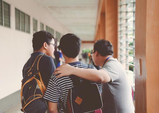 School children with backpacks on